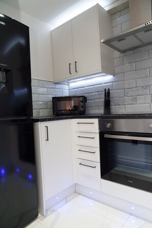 Monolocale Superior, bagno in camera | Cucina condivisa