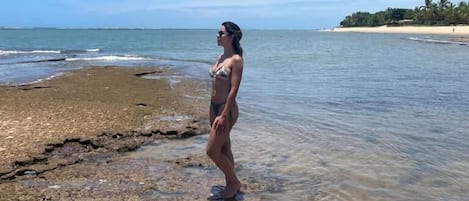 On the beach, white sand, free beach cabanas, sun loungers