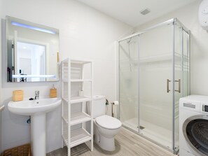 Shower, hair dryer, towels, toilet paper