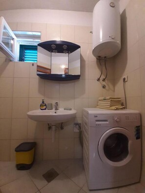 Bathtub, hair dryer, towels