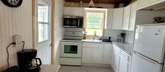 Quaint 2 bedroom water view cottage.  Near great golfing, beaches and breweries.