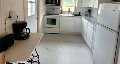 Quaint 2 bedroom water view cottage. Near great golfing, beaches and breweries.