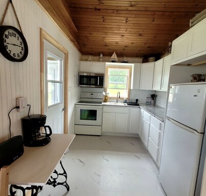 Quaint 2 bedroom water view cottage.  Near great golfing, beaches and breweries.
