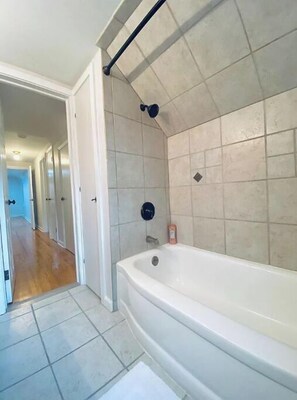 Bathtub, jetted tub, hair dryer, towels