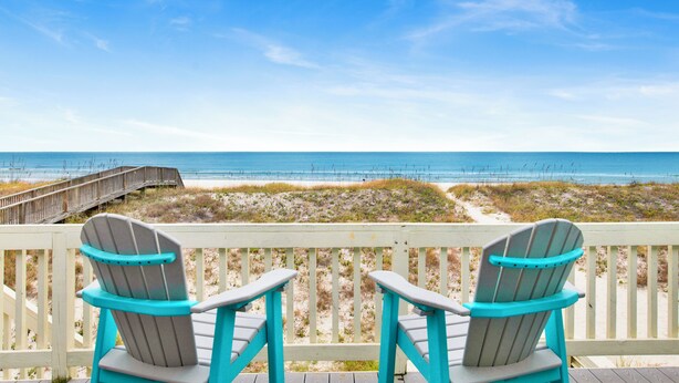 Two Adirondack chairs facing a beach with a wooden boardwalk and dunes. - Gulf Front Retreat | Beachfront Living | West Beach Favorite (Gulf Shores)