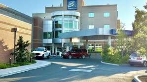 A modern hospital building with a Samaritans sign, a security vehicle, and a BMW parked in front. - Comfortable studio just 3 minutes drive to downtown Moses Lake (Moses Lake)