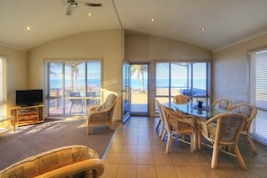 Beachfront Spa Villa (3BR) | Living area - Tasman Holiday Parks - Rollingstone (Rollingstone)