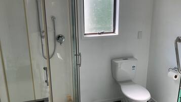 Shower, towels, soap, toilet paper