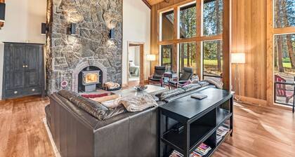 Opulent home with fairway view, fireplaces, huge deck, & hot tub