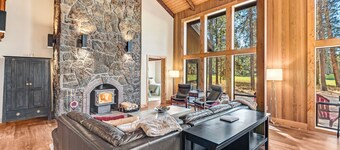Opulent home with fairway view, fireplaces, huge deck, & hot tub