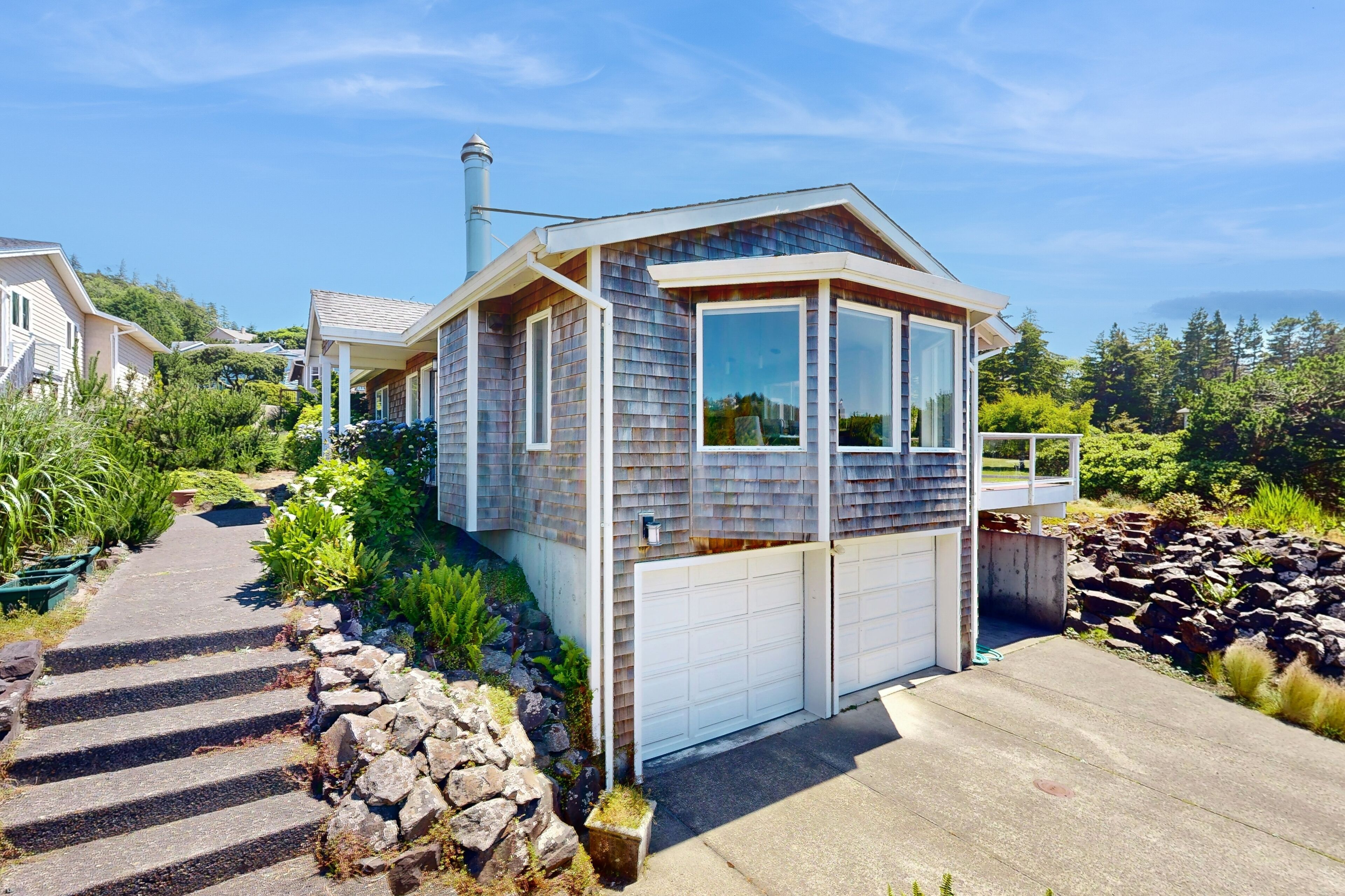 Stunning coastal home with ocean views, firepit & media room - walk to beach