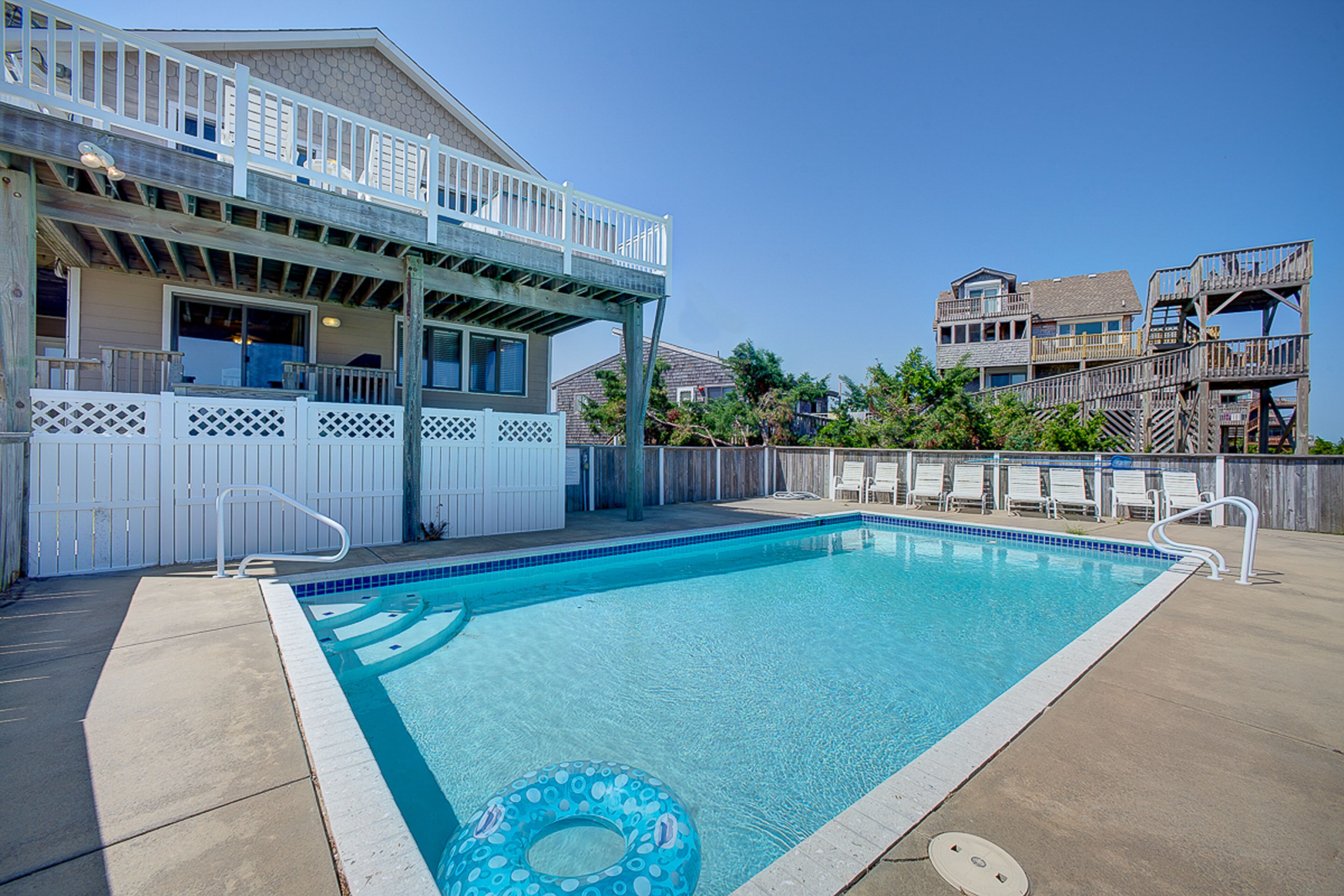Luxury beach home with beach view, private hot tub, heated pool, & fireplace