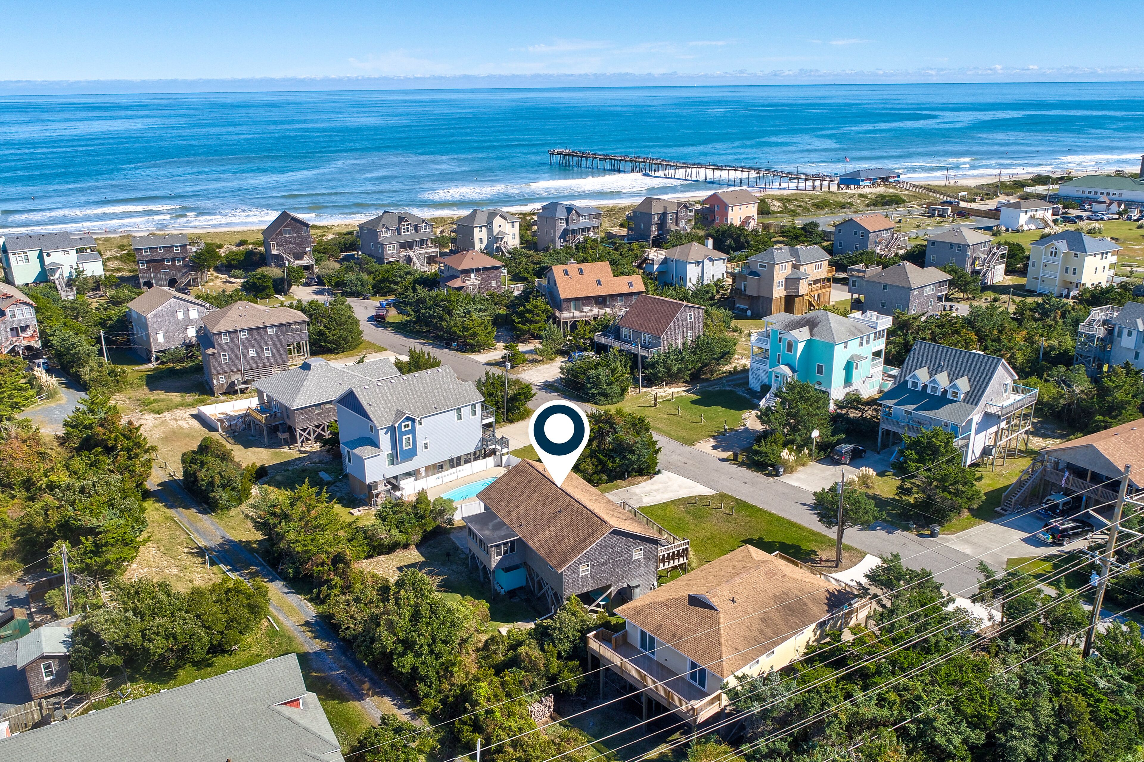 Raised home near the beach with deck, washer/dryer, outdoor shower, central a/c