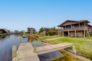 Enjoy a waterfront retreat with a scenic view from the balcony of this multi-story building.