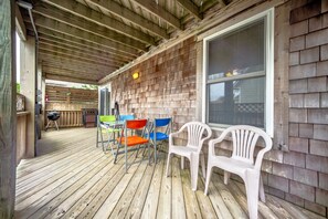 Relax in this outdoor space with a grill and comfortable seating.