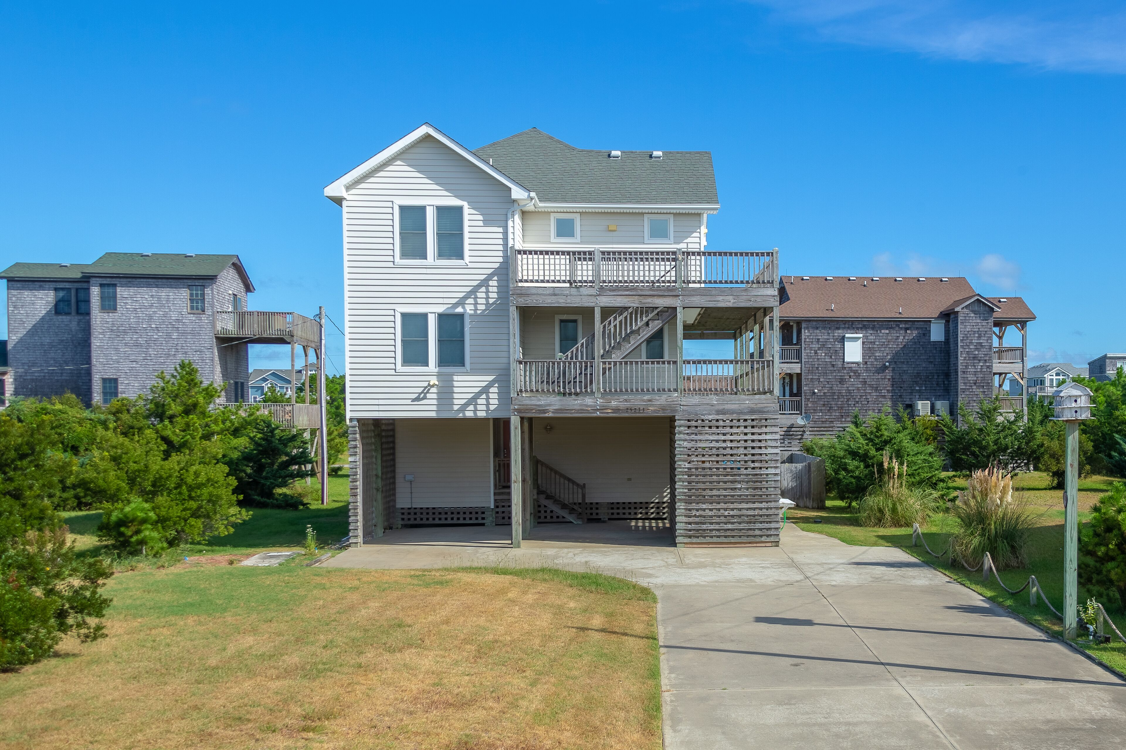 3-story home with multiple decks, grills, fish cleaning station, & private pool