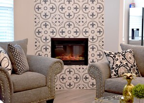Cozy living room with a fireplace and comfortable seating area.