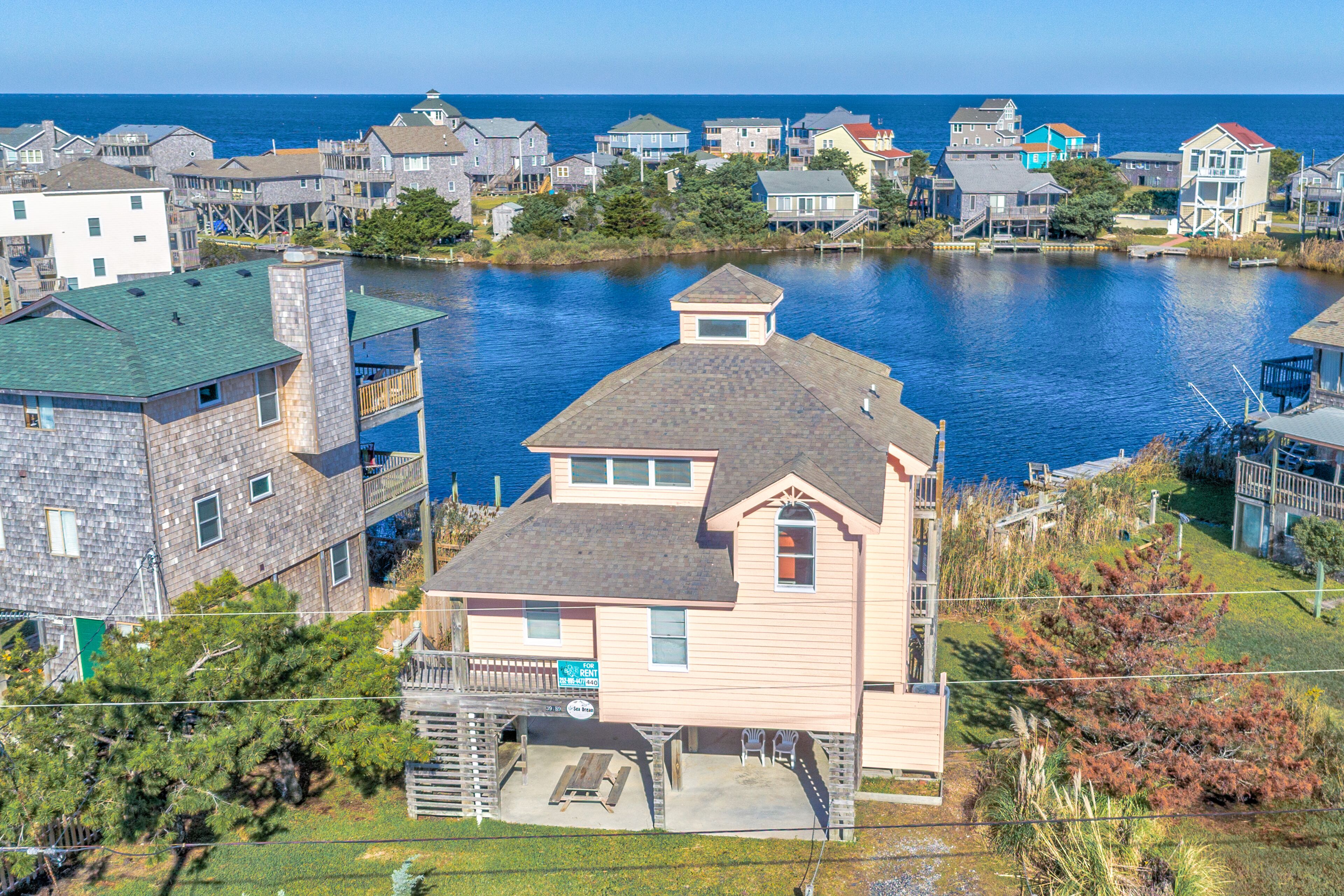 Gorgeous lagoon-front home steps from the sound with private dock & central AC