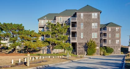 Fun-filled vacation home steps from beach with outdoor pool, AC, W/D, & balcony