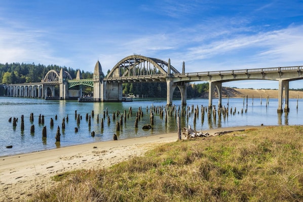 Spanning the river, this bridge offers a scenic walkway with views of the surrounding beach and water.