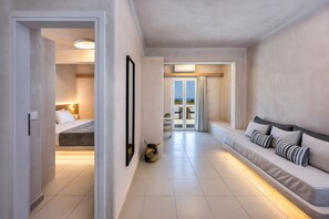 Honeymoon Suite, Sea View & Outdoor Hot Tub | Living area | 42-inch plasma TV with satellite channels, TV, books