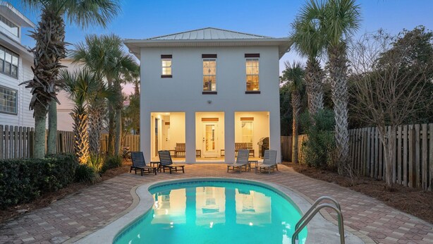 A two-story house with a swimming pool, outdoor seating, and palm trees. - 🏖Steps 2 Beach Access🏴‍ ☠️Pirate Themed🏝️Private Pool/Luxury/Location (Miramar Beach)