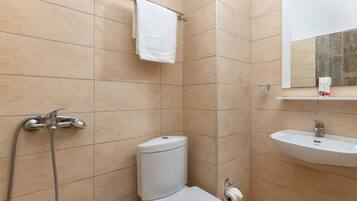 Bathtub, hair dryer, towels, soap