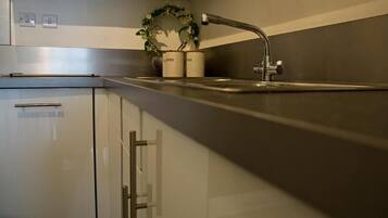 Basic Apartment | Private kitchen | Full-sized fridge, microwave, oven, toaster