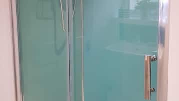 Shower, hair dryer, towels, toilet paper