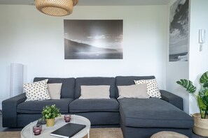 Basic Room, 1 Queen Bed, Sea View | Living room | 42-inch TV with cable channels, fireplace, books - In the Village - Madeira Surf Camp I (Machico)