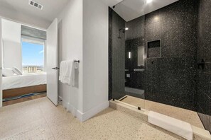 Shower, hair dryer, towels, shampoo