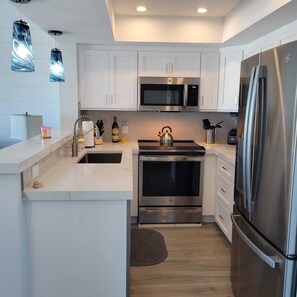 Fridge, microwave, stovetop, dishwasher - Coconuts108 - GULFFRONT - 1BR/1BA with pool - By Island Real Estate Vacations (Holmes Beach)