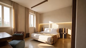 A modern hotel room with a bed, a desk, and a chair. - San Francesco Heritage Hotel (Alghero)