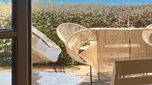 A patio with outdoor furniture, a view of the sea, and a mountainous landscape in the distance. - Villa " La plage "  waterfront villa, swimming pool, garden, 16 p (Carqueiranne)