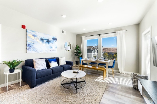 Soak in the sunlight and mountain views from this cozy living room—perfect for movie nights or morning coffee chats.