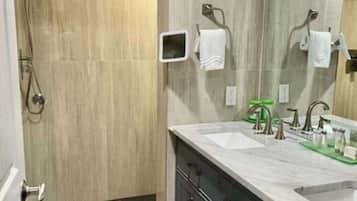 Shower, hair dryer, towels, soap