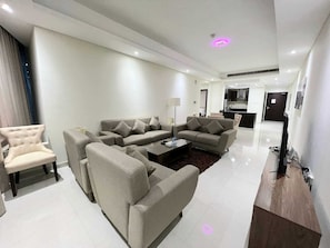 Deluxe Apartment, 2 Bedrooms, City View | Living area | 55-inch LED TV with satellite channels - Sirius Tower (Manama)