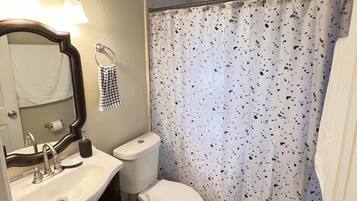 Combined shower/tub, hair dryer, towels, soap