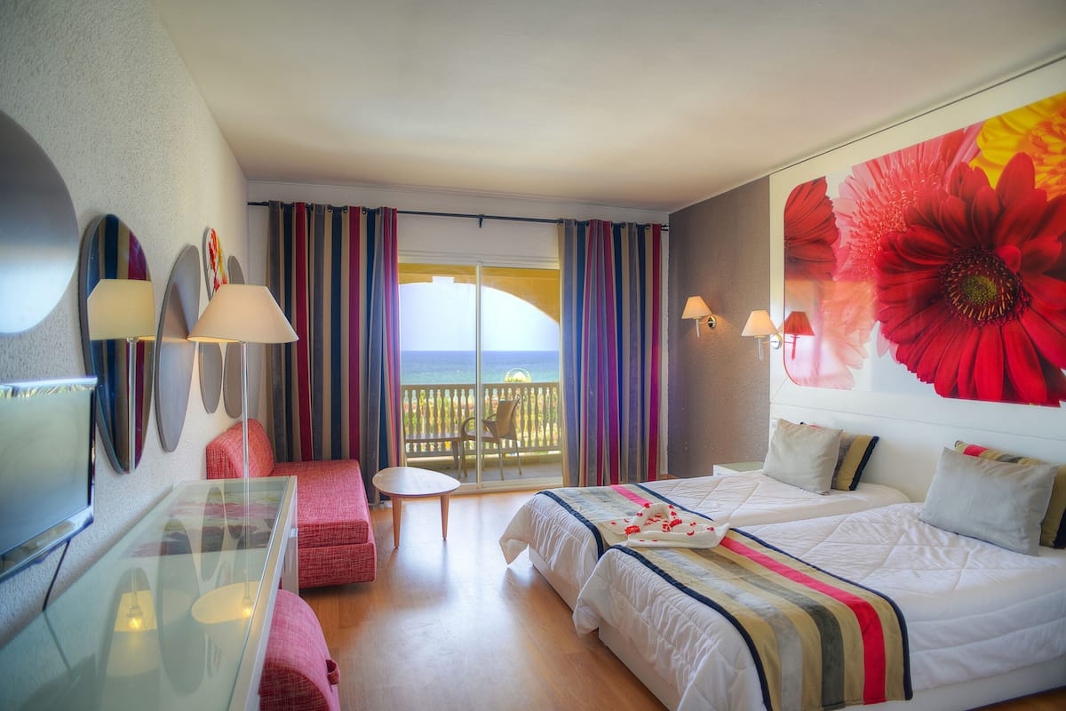 hypo-allergenic bedding, free minibar items, laptop workspace