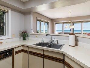 Fridge, microwave, oven, stovetop - Water's Edge 1 | Beachfront Condo with Pool, Moments from Downtown (South Haven)