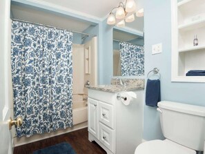 Bathtub, hair dryer, towels