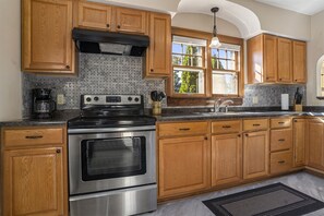 Fridge, microwave, oven, stovetop - Heart of Soha | Historic Downtown Townhouse | Pet Friendly | Moments to Lake MI (South Haven)