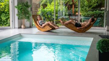 Indoor pool, a heated pool, sun loungers