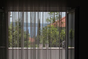 Enjoy a serene view of the surrounding landscape through the window's mesh screen.