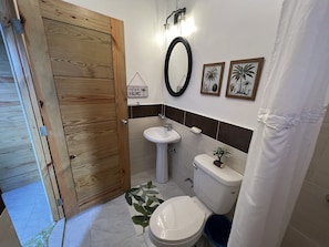 Shower, towels, soap, toilet paper