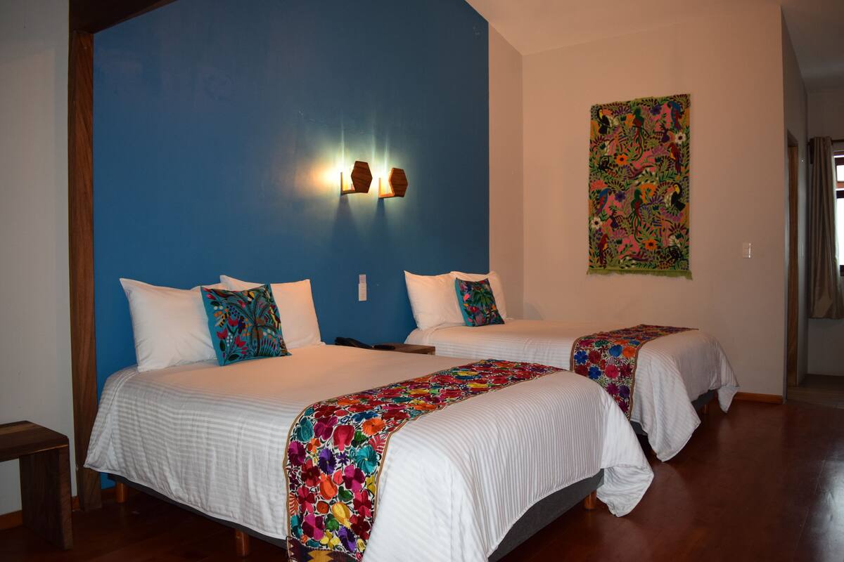 Family Room | Premium bedding, memory-foam beds, desk, free WiFi