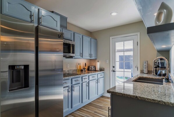 Enjoy cooking in this well-equipped kitchen with a microwave, toaster, and coffee maker.