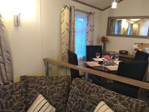 Cabin | Living room | 30-inch TV with digital channels, fireplace - Lovely 3-bed Lodge in Towyn Near Rhyl (Abergele)
