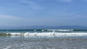 On the beach, sun loungers, beach towels