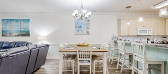 Dual-suite Magnolia Pointe condo with golf, pools, and screened patio